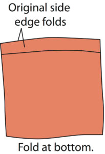 illustration showing a fold made over one solid side of a t-shirt body